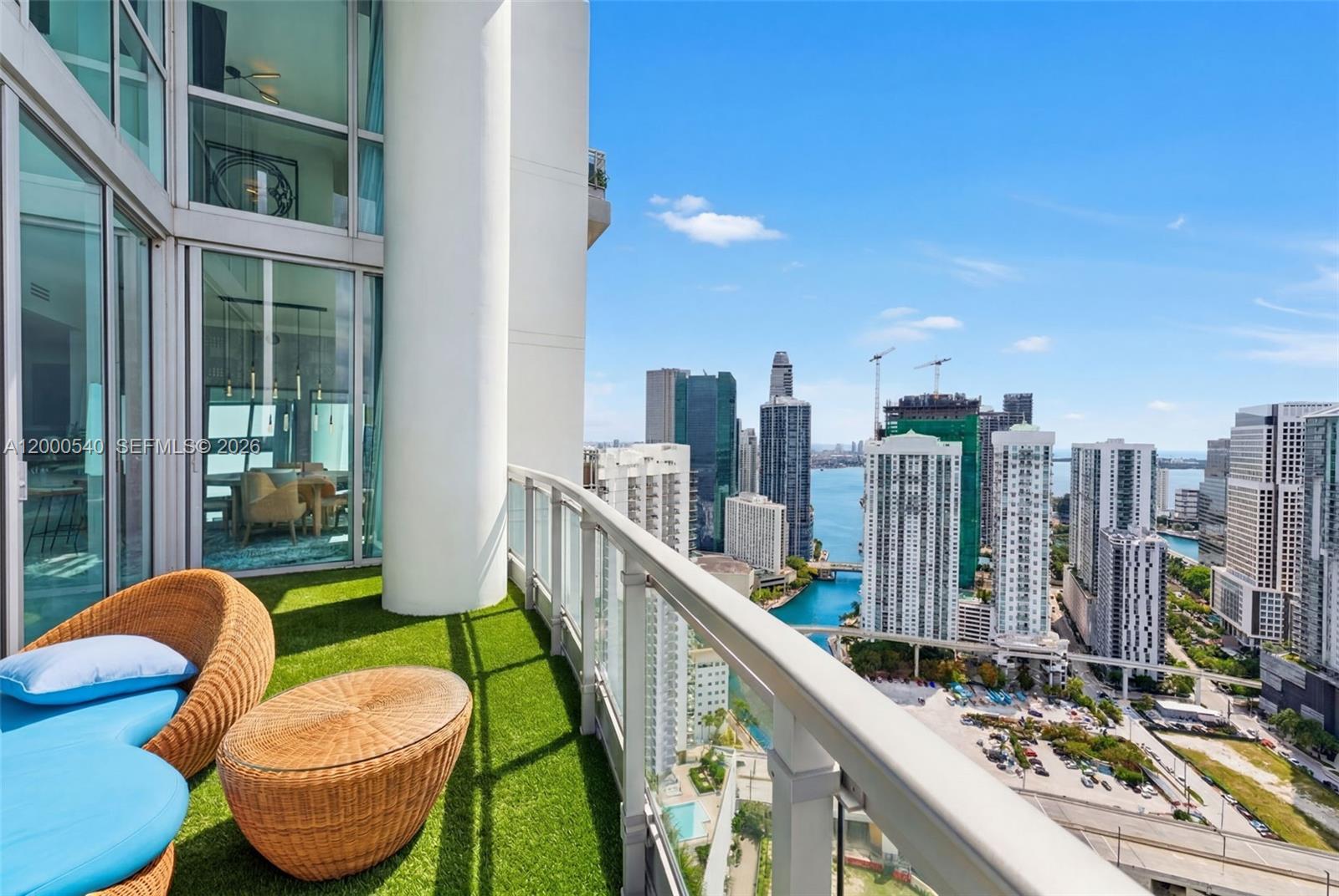 90 Southwest 3rd Street, Unit PH12 Miami, FL 33130 - Photo 19 of 40 a view of a balcony with chairs
