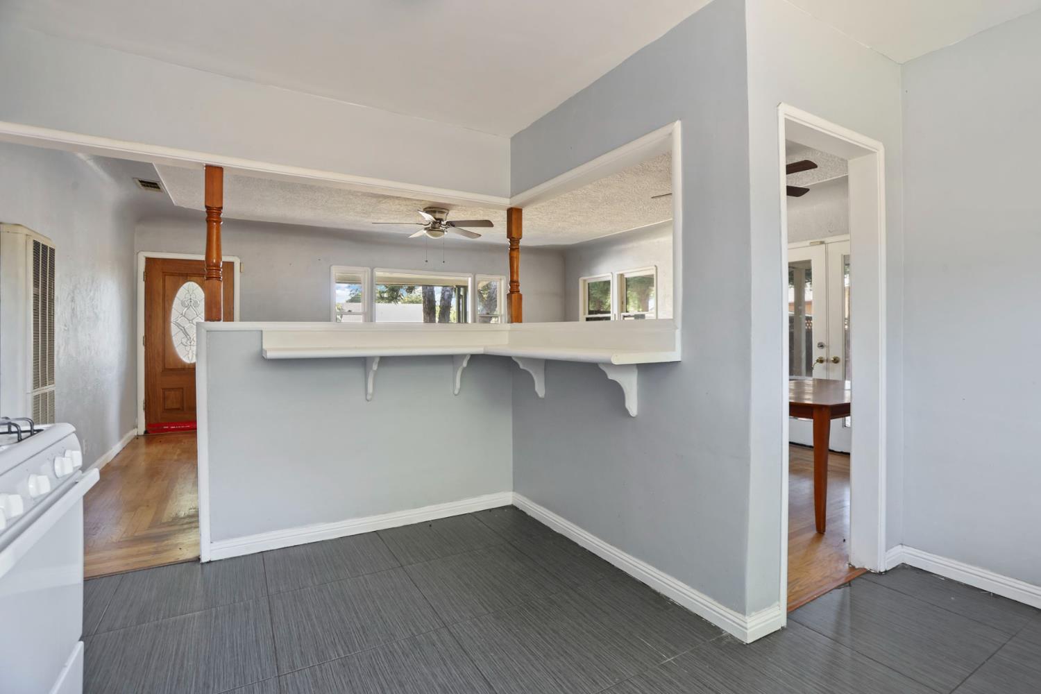 916 Elm Avenue Modesto, CA 95351 - Photo 17 of 52 18. Kitchen pass-through and living room view A charming built-in shelf/pass-through gives this kitchen a little personality while keeping the front room within easy reach.