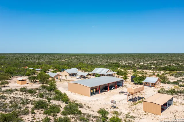 a view of a terrace with a table and chairs