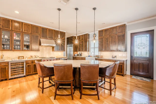 a view of a dining table chairs and chandelier