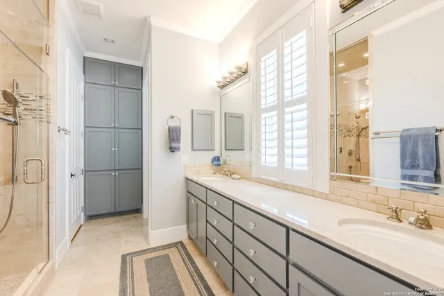a bathroom with a double vanity sink and a bathtub