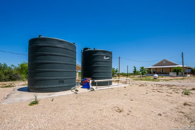 a view of a wooden house with a outdoor space