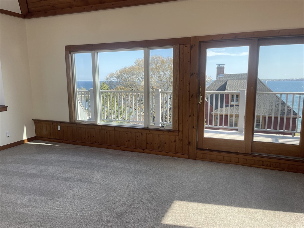 98 Rockland Street, Unit 3 Swampscott, MA 01907 - Photo 12 of 19 an empty room with windows