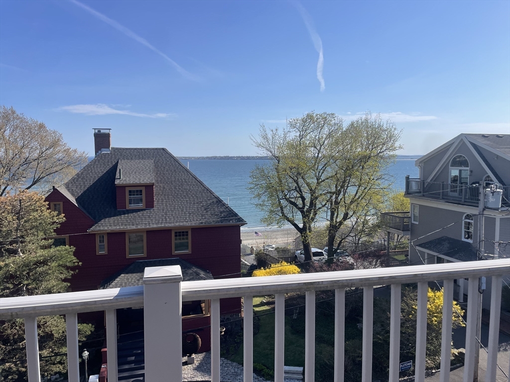 98 Rockland Street, Unit 3 Swampscott, MA 01907 - Photo 5 of 16 a front view of a house with trees