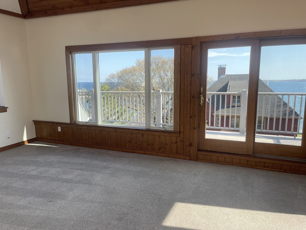98 Rockland Street, Unit 3 Swampscott, MA 01907 - Photo 9 of 16 an empty room with windows
