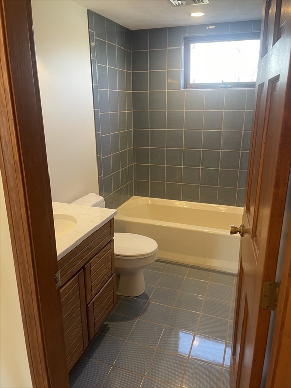 98 Rockland Street, Unit 3 Swampscott, MA 01907 - Photo 10 of 16 a bathroom with a sink a toilet and bathtub