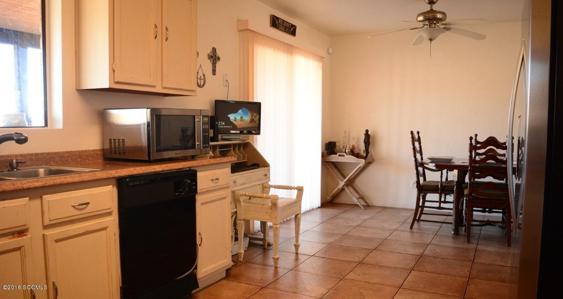 1032 Via Independencia Rio Rico, AZ 85648 - Photo 9 of 22 a kitchen with a sink cabinets and appliances