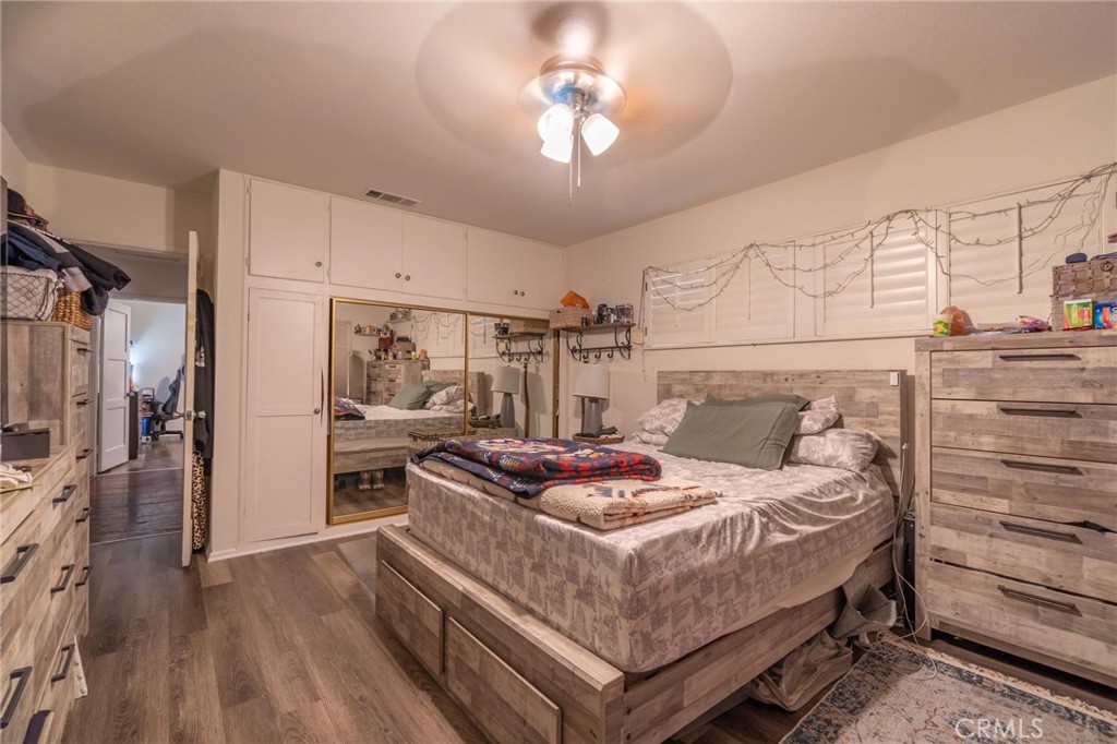 9920 Broadway Temple City, CA 91780 - Photo 13 of 26 a bedroom with a bed and a chandelier