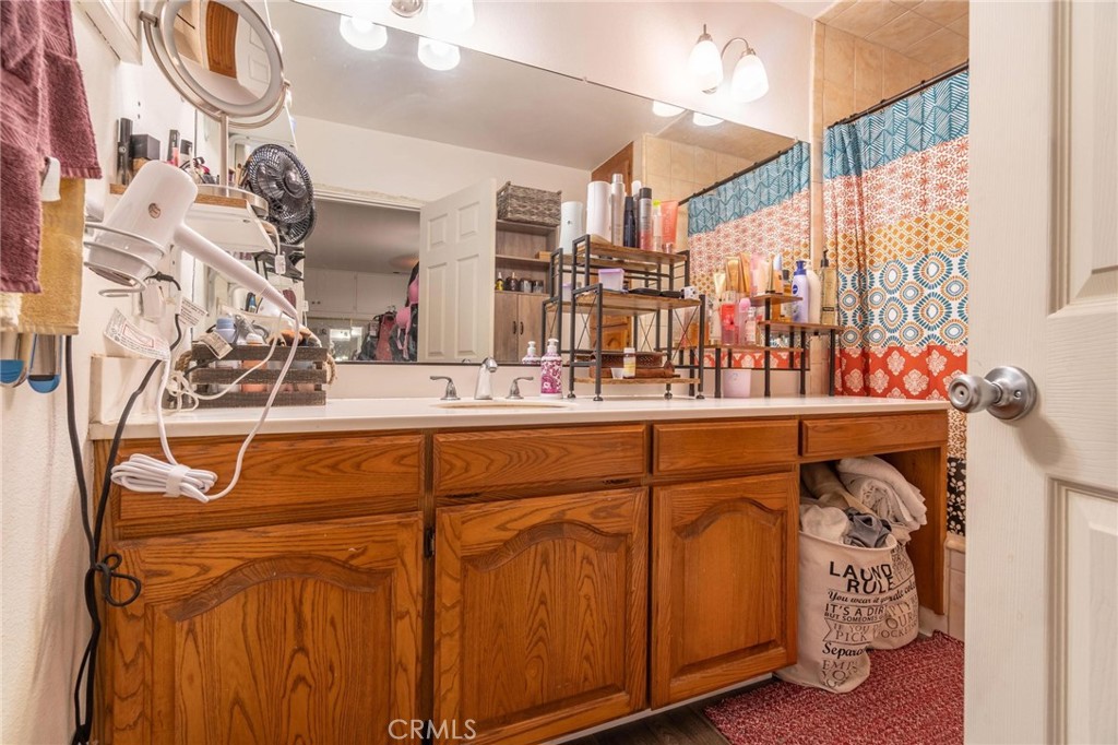 9920 Broadway Temple City, CA 91780 - Photo 15 of 26 a bathroom with a sink and a mirror