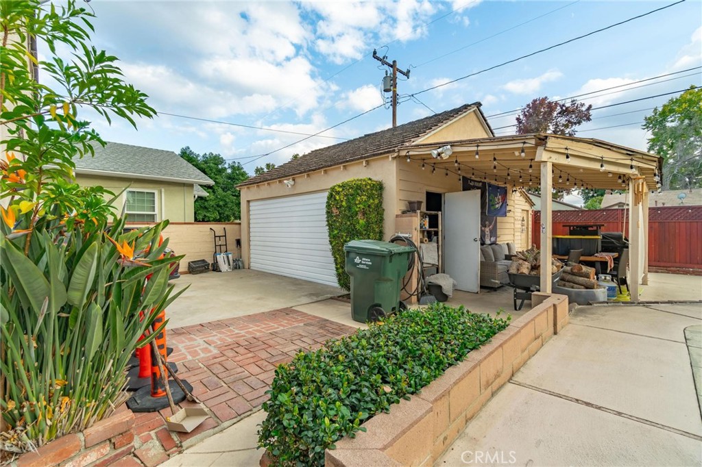 9920 Broadway Temple City, CA 91780 - Photo 22 of 26 a view of a patio with table and chairs with potted plants