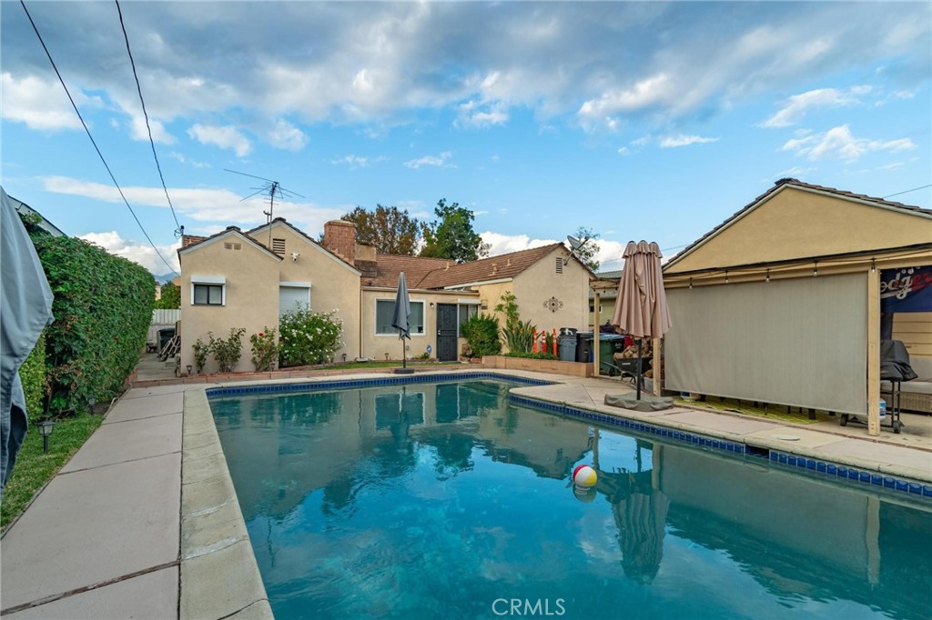 9920 Broadway Temple City, CA 91780 - Photo 25 of 26 a swimming pool with outdoor seating and yard