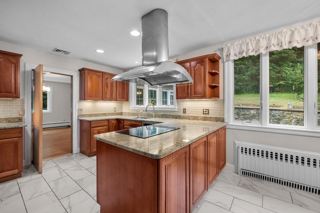 42 Bypass Road Lincoln, MA 01773 - Photo 12 of 42 a kitchen with stainless steel appliances granite countertop a stove and a sink