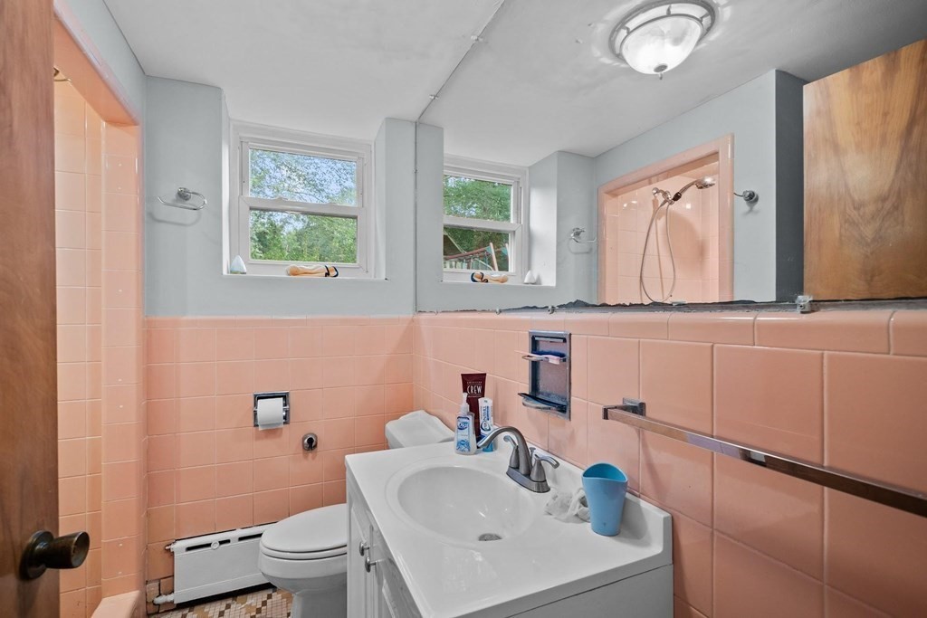 42 Bypass Road Lincoln, MA 01773 - Photo 23 of 42 a bathroom with a sink mirror and toilet