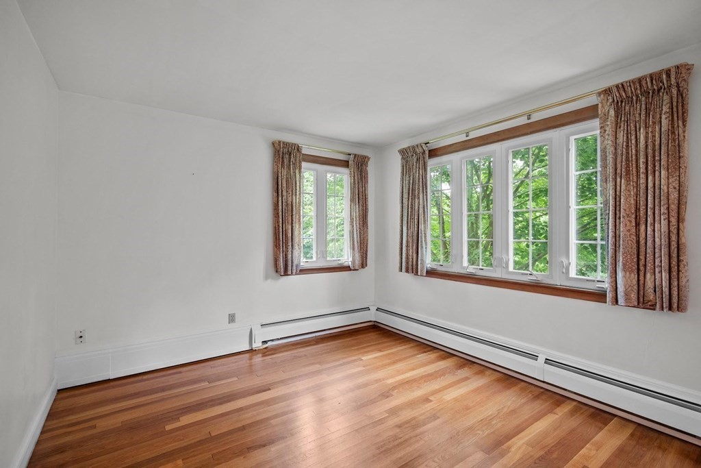 42 Bypass Road Lincoln, MA 01773 - Photo 24 of 42 a view of an empty room with wooden floor and a window
