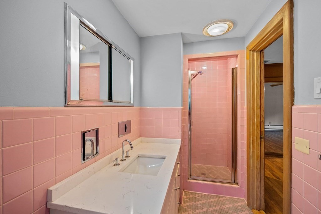 42 Bypass Road Lincoln, MA 01773 - Photo 25 of 42 a bathroom with a sink a vanity and a mirror