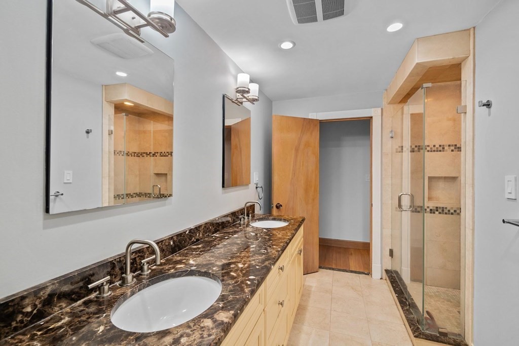 42 Bypass Road Lincoln, MA 01773 - Photo 27 of 42 a en suite bathroom with a double vanity sink a mirror and a shower