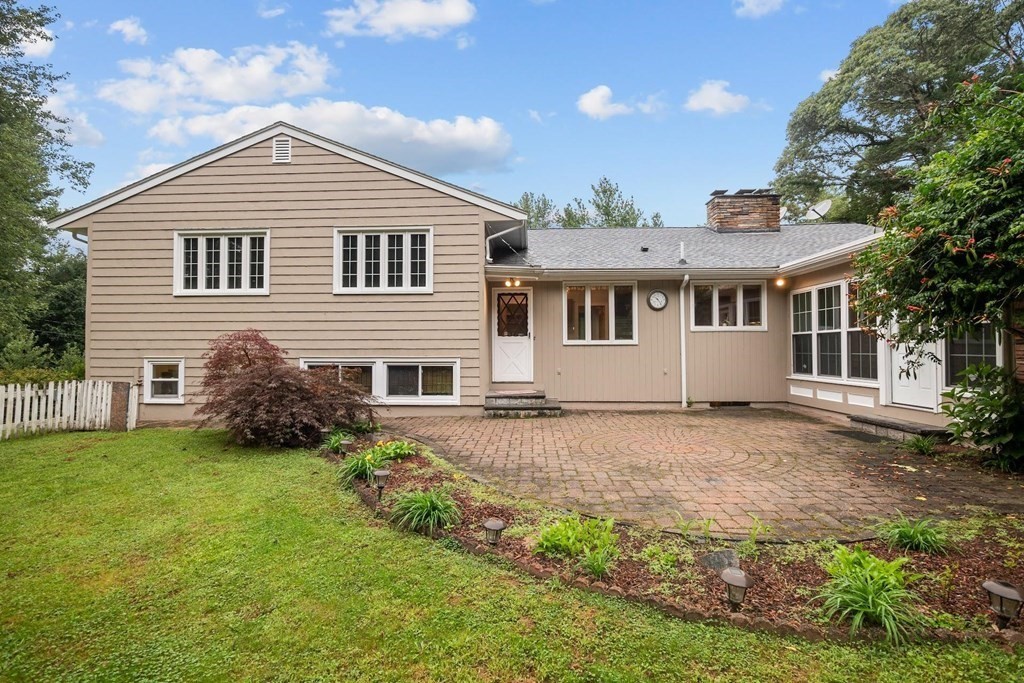 42 Bypass Road Lincoln, MA 01773 - Photo 37 of 42 a front view of a house with a garden
