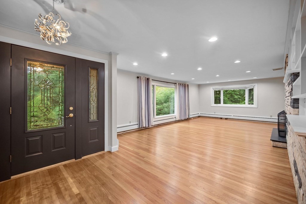 42 Bypass Road Lincoln, MA 01773 - Photo 5 of 42 a view of empty room with wooden floor and fan