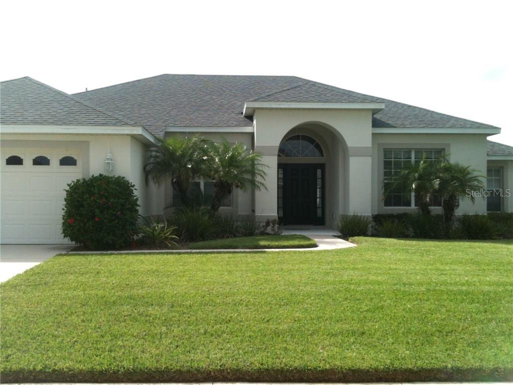 396 Magneta Loop Auburndale, FL 33823 - Photo 1 of 1 a front view of a house with garden