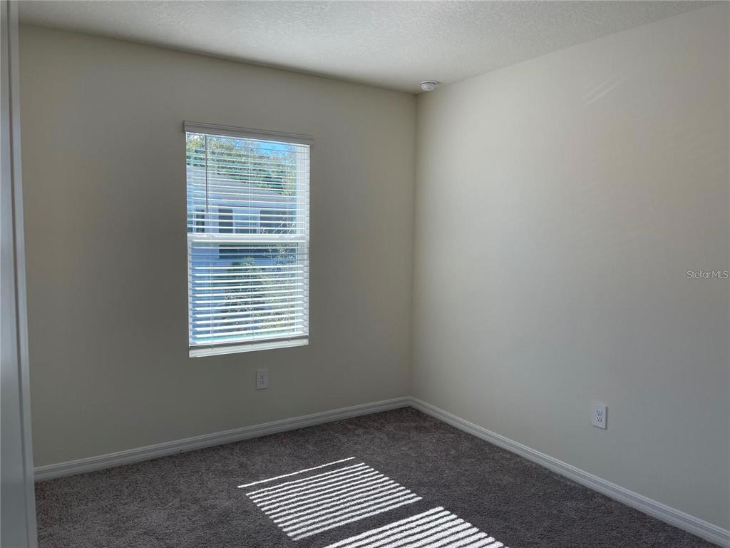9011 Milestone Drive Sarasota, FL 34238 - Photo 17 of 32 a view of an empty room with a window