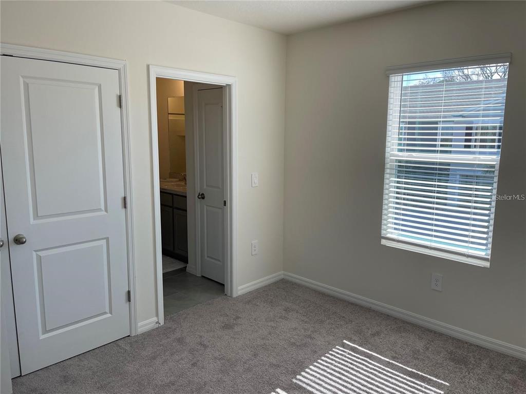 9011 Milestone Drive Sarasota, FL 34238 - Photo 21 of 32 an empty room with a window