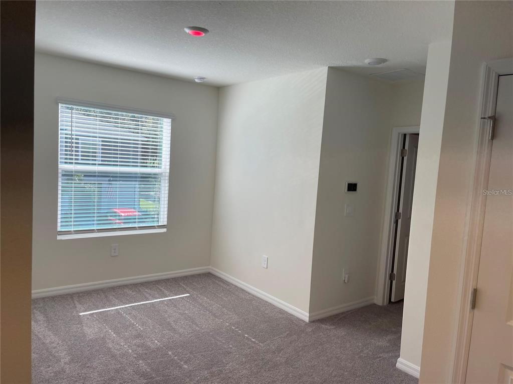 9011 Milestone Drive Sarasota, FL 34238 - Photo 22 of 32 a view of an empty room and window