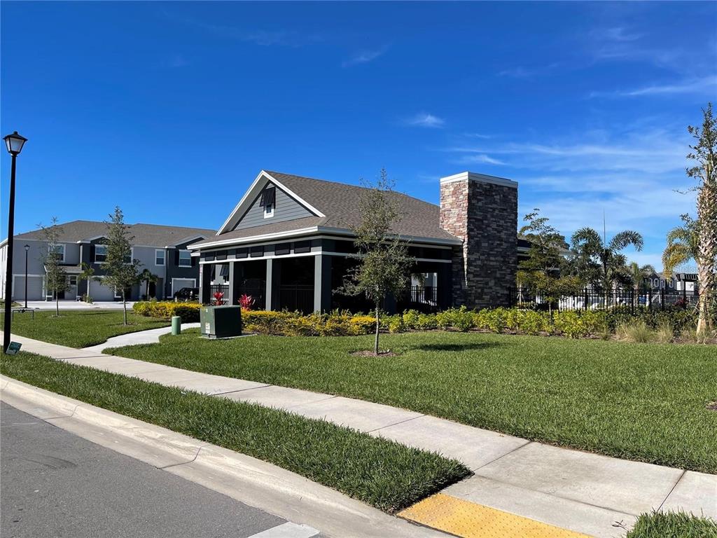 9011 Milestone Drive Sarasota, FL 34238 - Photo 26 of 32 a front view of a house with a yard