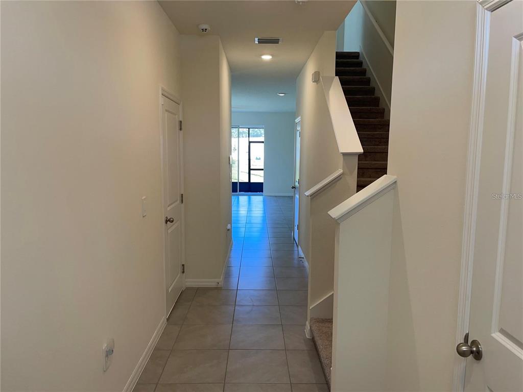 9011 Milestone Drive Sarasota, FL 34238 - Photo 3 of 32 a view of entryway and hall with wooden floor