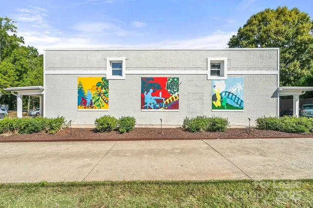 a front view of multiple houses with outdoor space