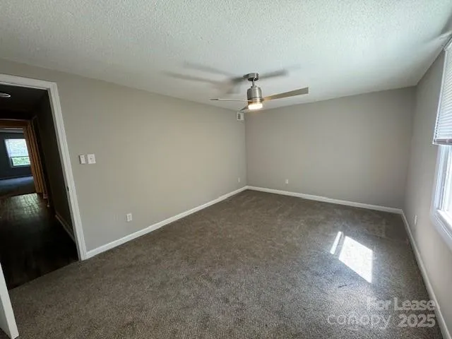 an empty room with a empty space and windows