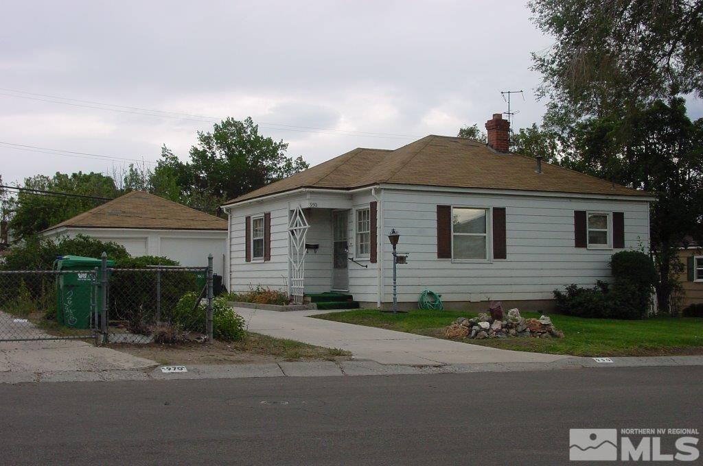950 Vine Street Reno, NV 89503 - Photo 1 of 1 a front view of a house with a yard and garage