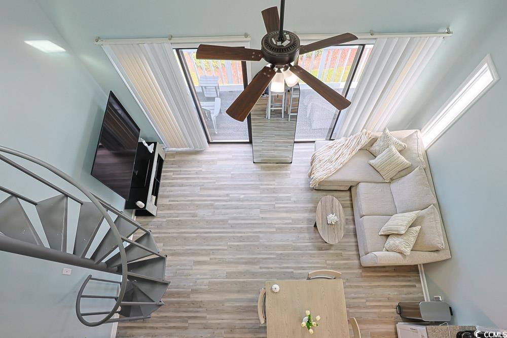 3700 Golf Colony Lane, Unit 5B Little River, SC 29566 - Photo 20 of 27 Living room with light wood-style flooring and a ceiling fan