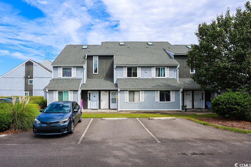 3700 Golf Colony Lane, Unit 5B Little River, SC 29566 - Photo 27 of 27 View of building exterior featuring uncovered parking
