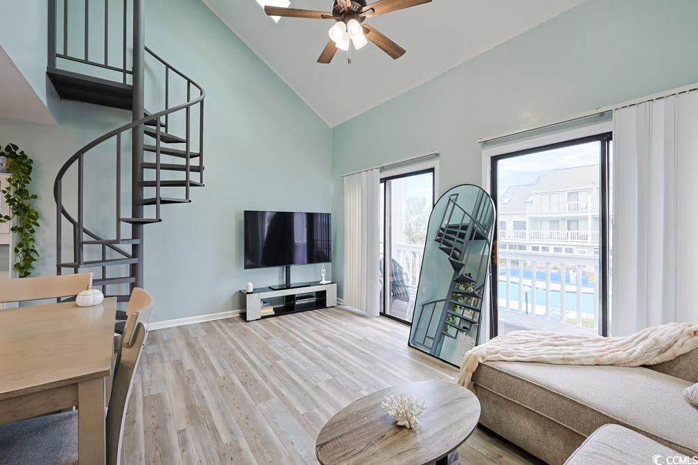 3700 Golf Colony Lane, Unit 5B Little River, SC 29566 - Photo 5 of 27 Living room featuring stairs, high vaulted ceiling, wood finished floors, and a ceiling fan