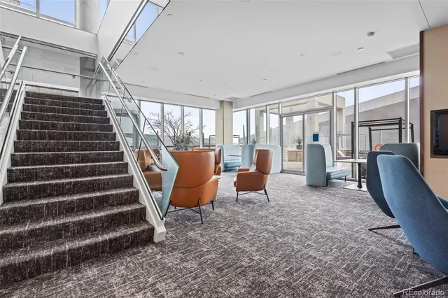 a living room with furniture a window and a table