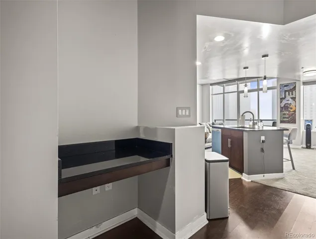 a kitchen with a sink and cabinets