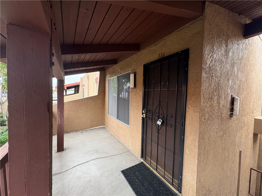 a view of hallway with wooden floor