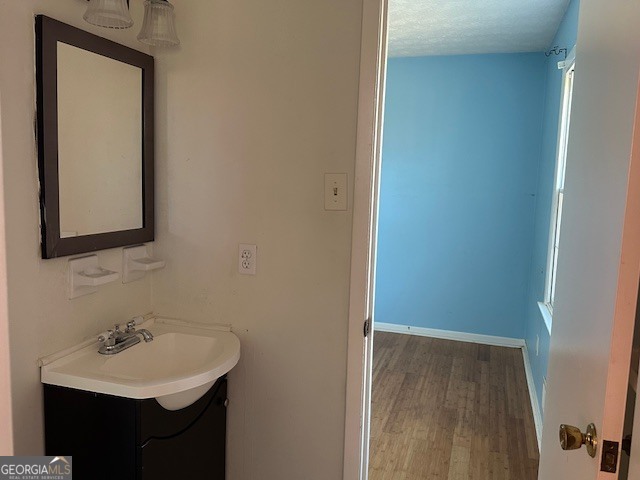 6892 Maddox Road Morrow, GA 30260 - Photo 12 of 20 a bathroom with a sink and a mirror