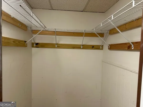 a bathroom with a toilet a sink a bathtub and mirror