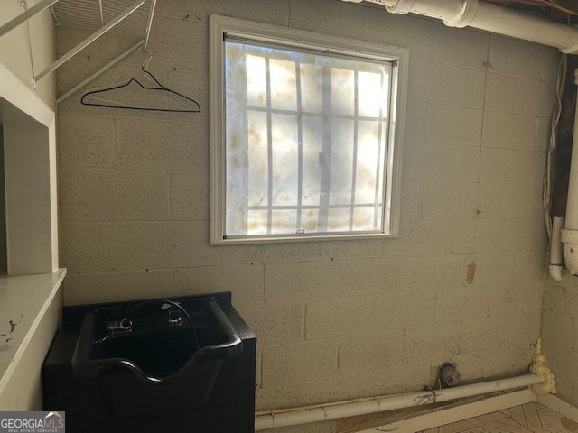 6892 Maddox Road Morrow, GA 30260 - Photo 18 of 19 a bathroom with a granite countertop sink and a window
