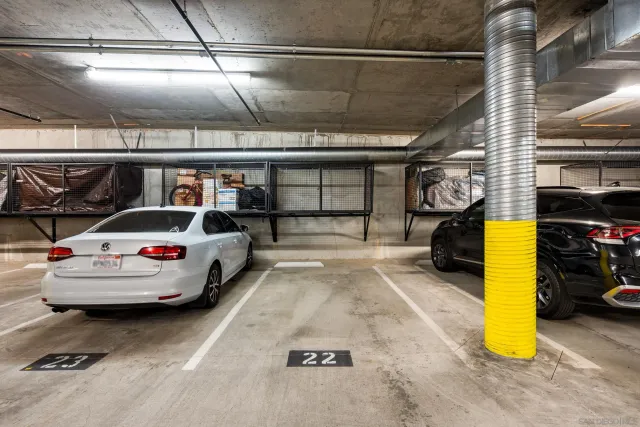a view of parking garage with cars
