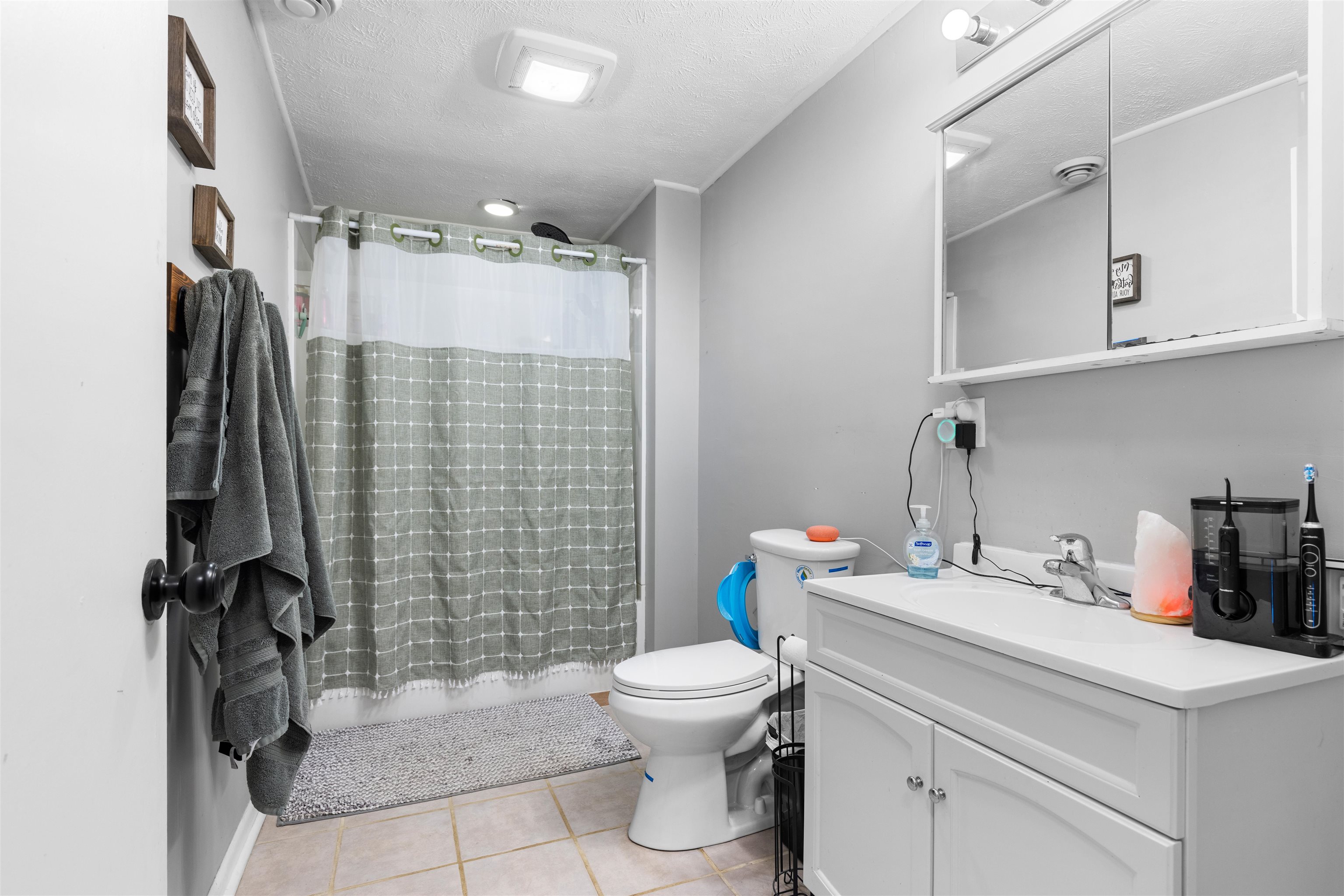 306 West Front Street Mount Morris, IL 61054 - Photo 11 of 15 a bathroom with a sink toilet and shower