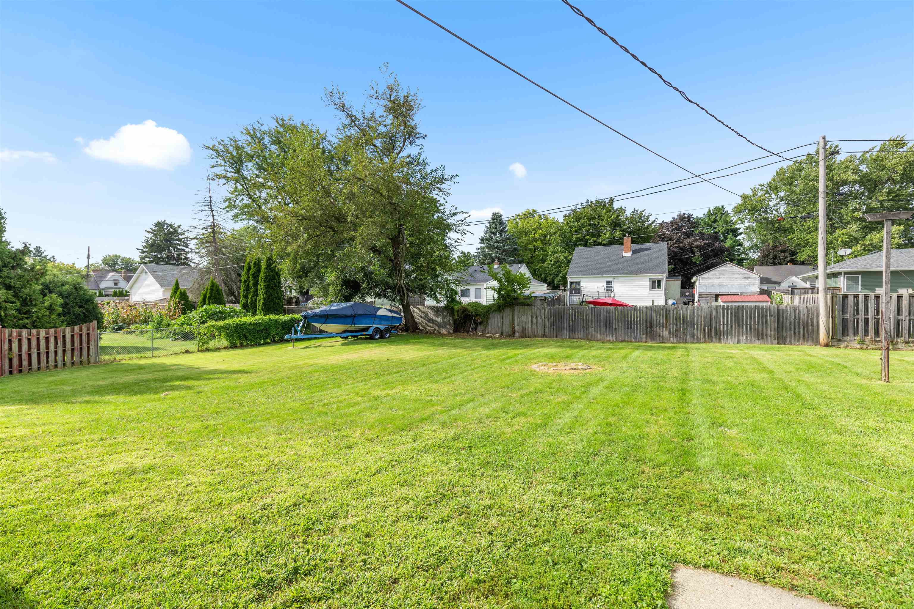 306 West Front Street Mount Morris, IL 61054 - Photo 14 of 15 a view of a backyard with a garden and plants