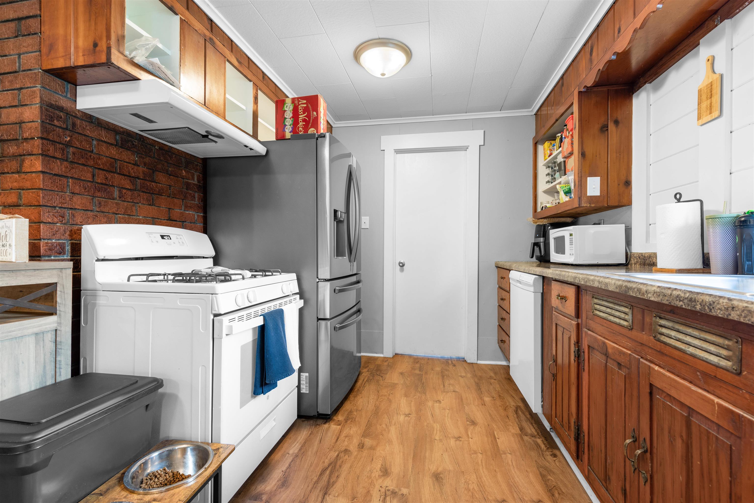 306 West Front Street Mount Morris, IL 61054 - Photo 7 of 15 a kitchen with a stove and a refrigerator