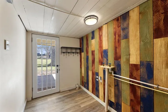 a view of hallway with furniture and windows