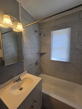 a bathroom with a sink and a bathtub
