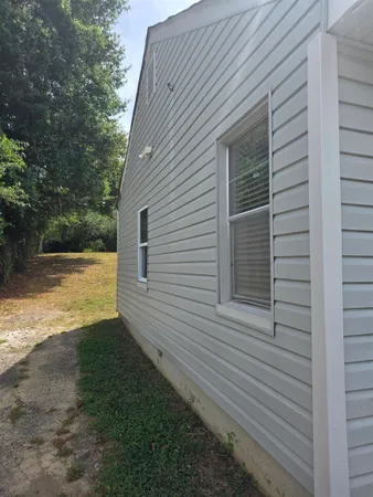 a view of a backyard of the house