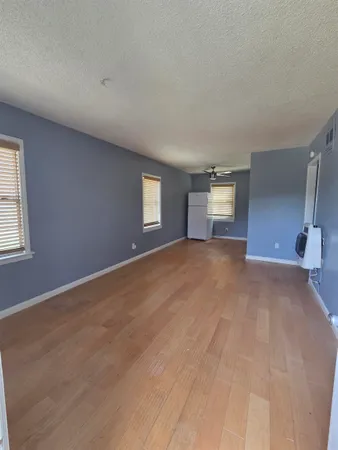 a view of empty room with windows