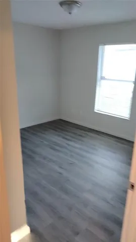 a kitchen with granite countertop a stove a sink and a microwave