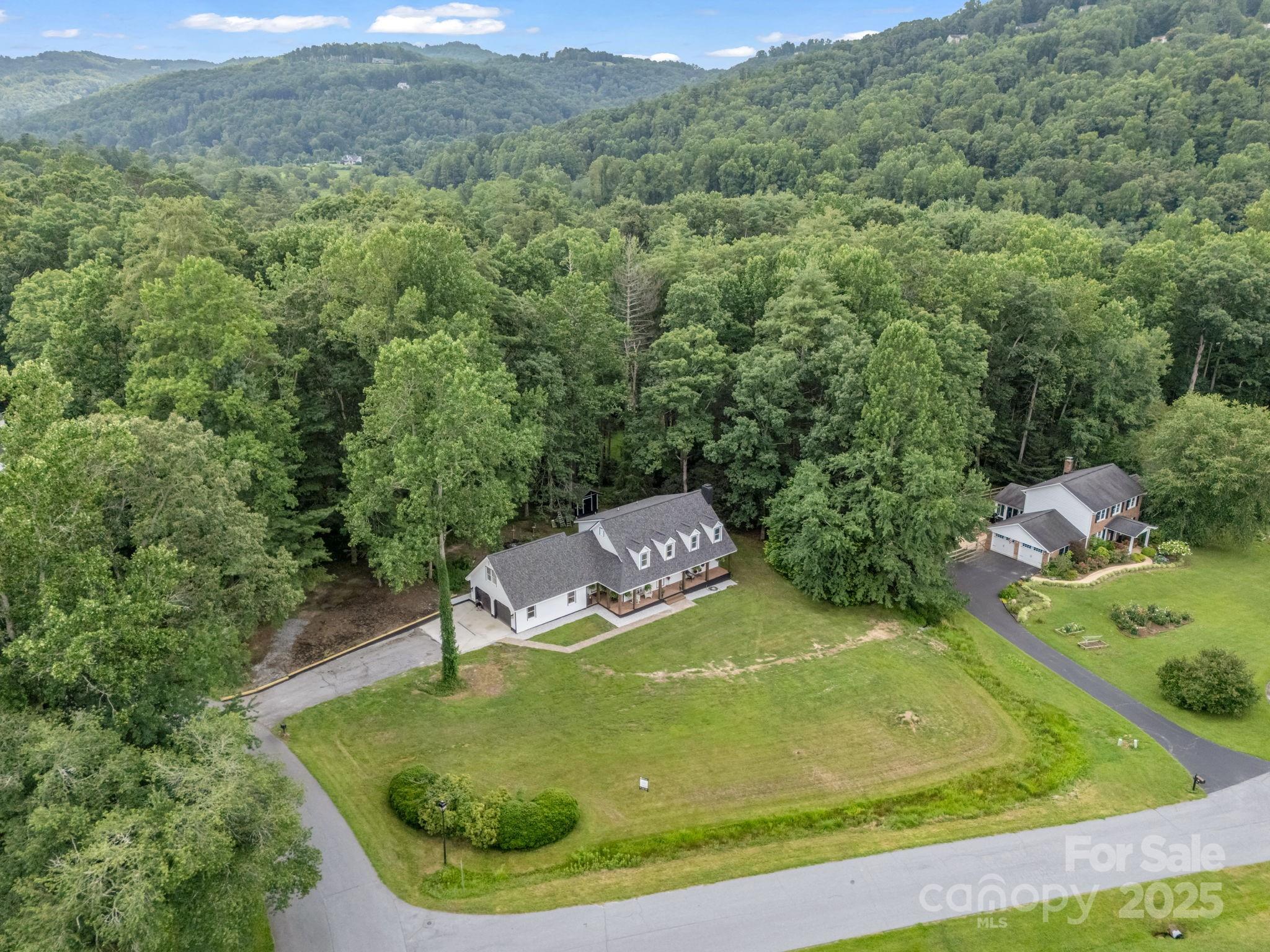 a view of a swimming pool with a yard